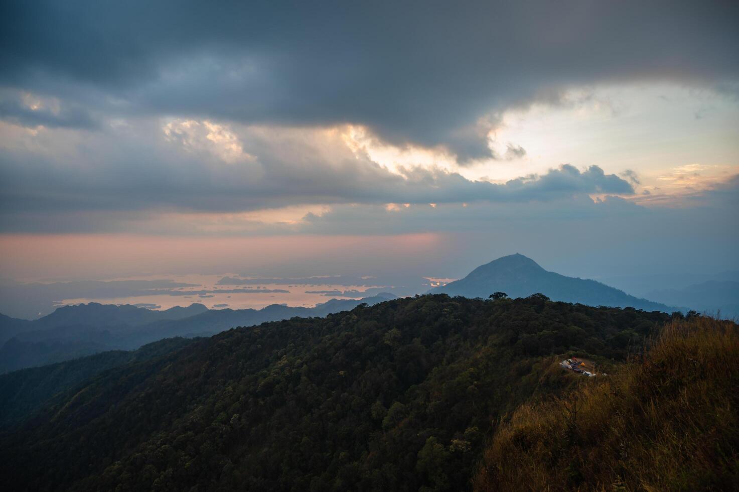 Beautiful mountain range and sunset on khao san nok wua kanchanaburi.Khao San Nok Wua is the highest mountain in Khao Laem National Park. It is 1767 meters above sea level. photo