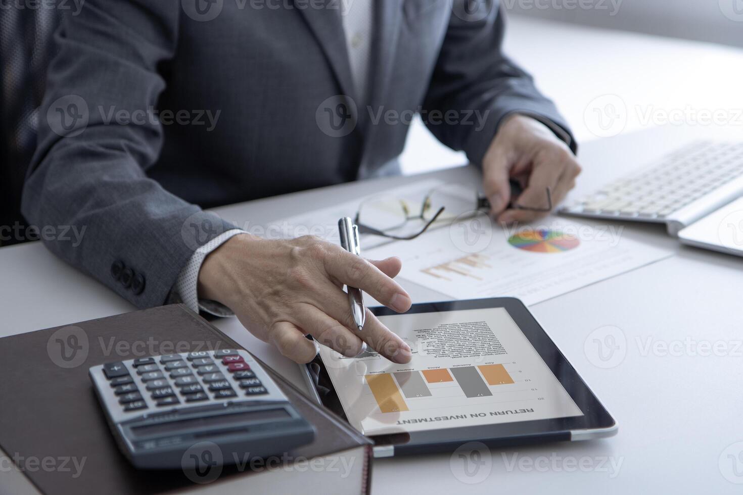 Reviewing business information and a return on investment photo