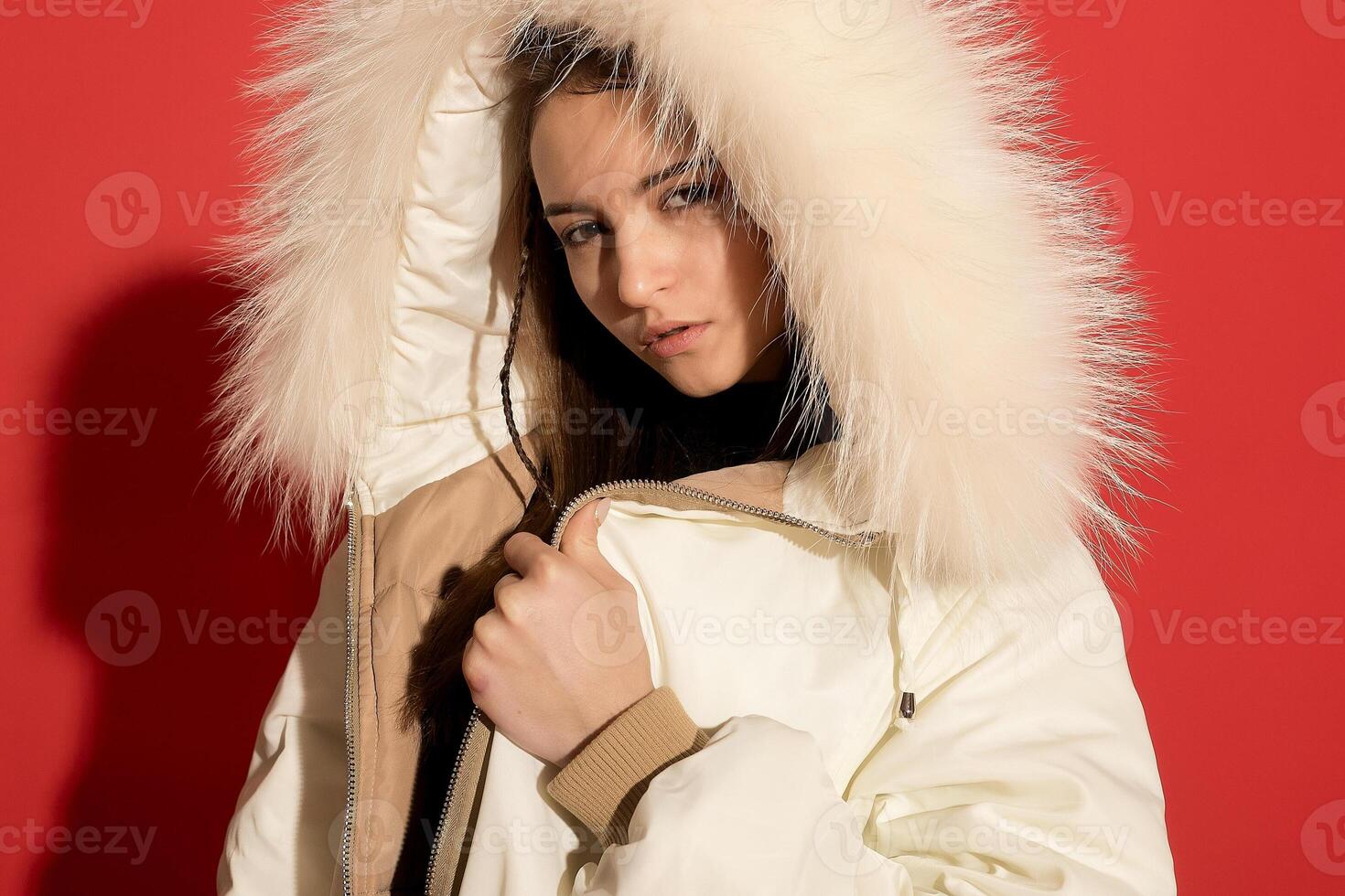 girl white jacket poses red background photo