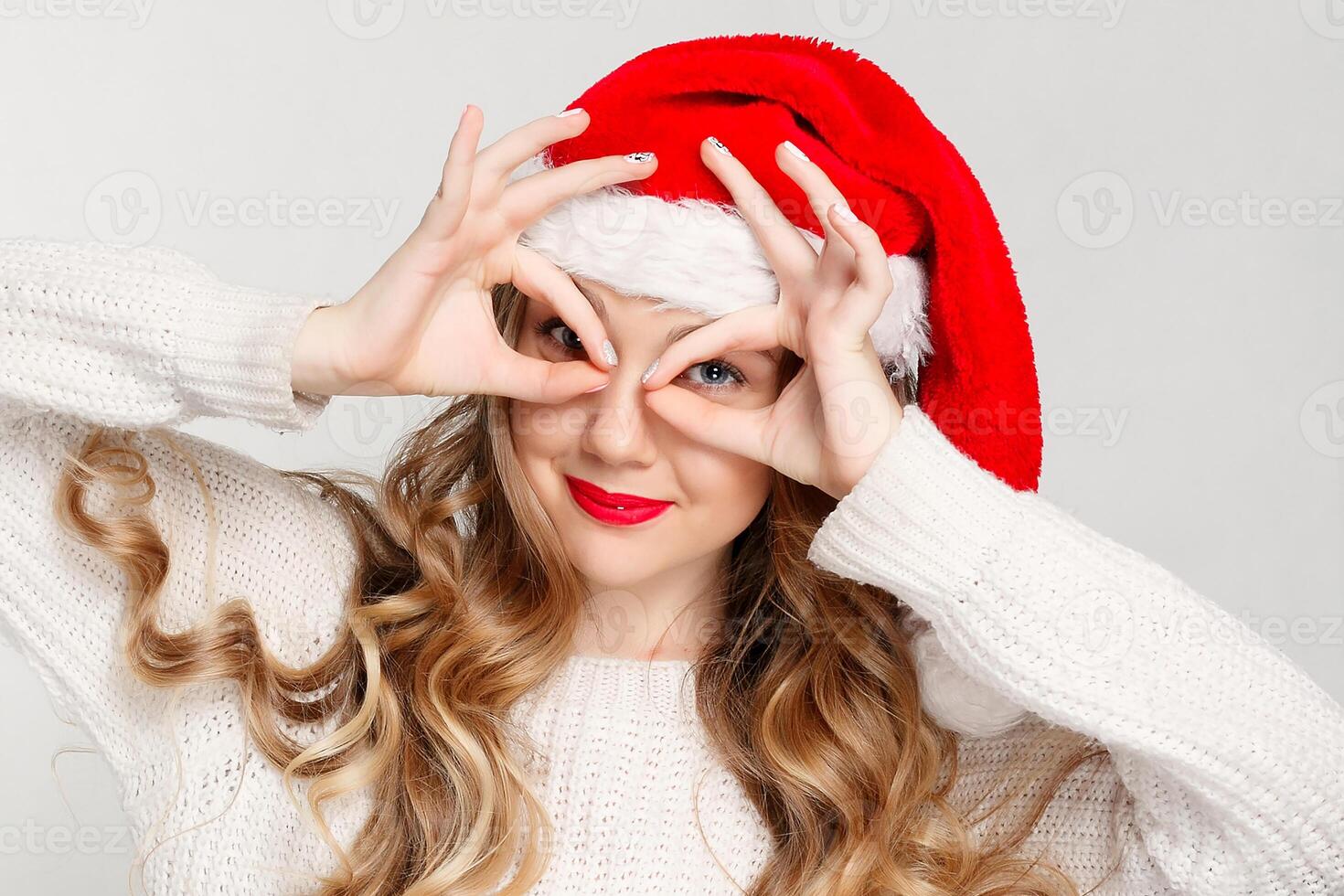 Beautiful female model wear santa hat photo
