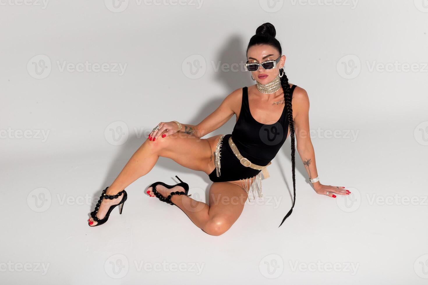 Skinny woman strip. Black lingerie photo