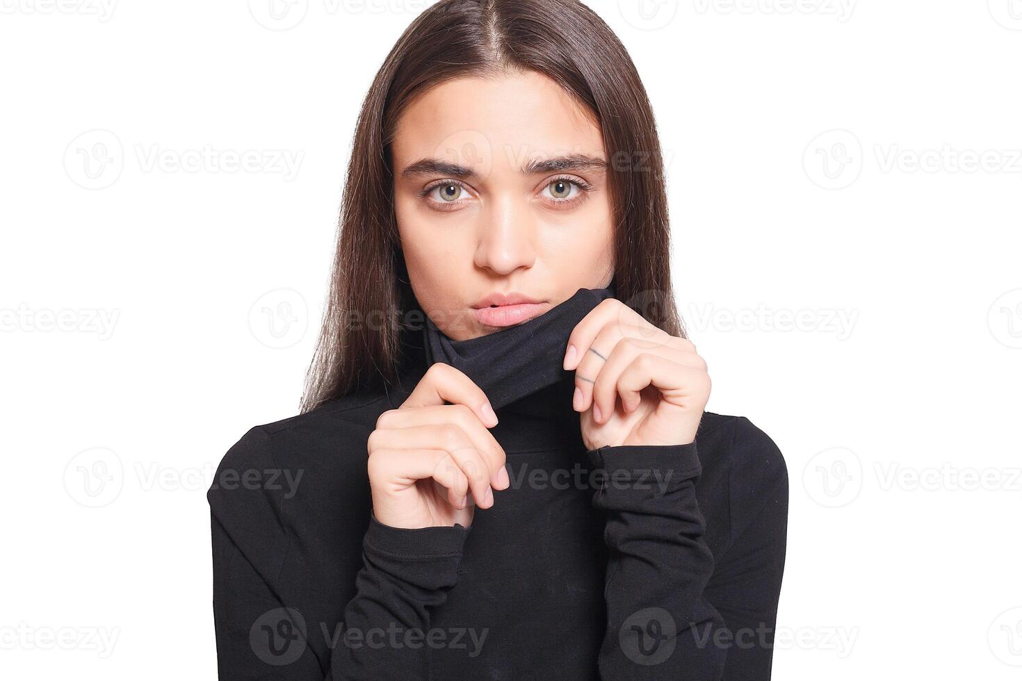 Confident female wearing black turtleneck sweater while posing photo