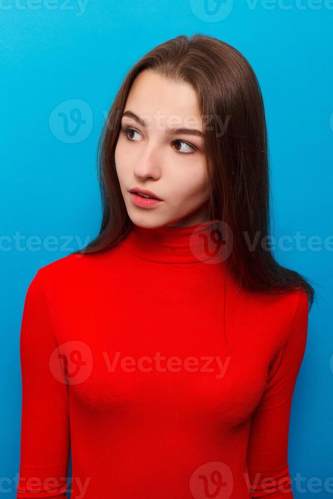 Portrait of young woman with shocked facial expression photo