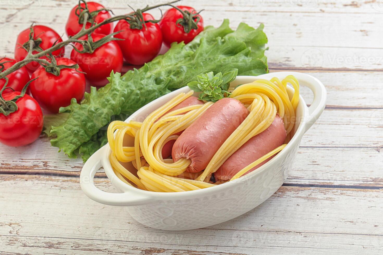 Mini sausages with pasta spaghetti photo