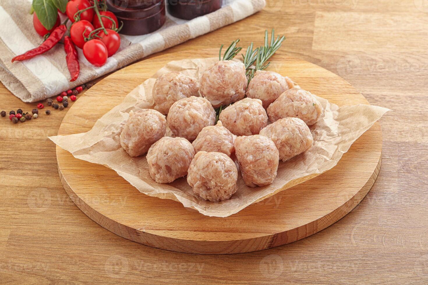 Raw chicken meatballs for cooking photo