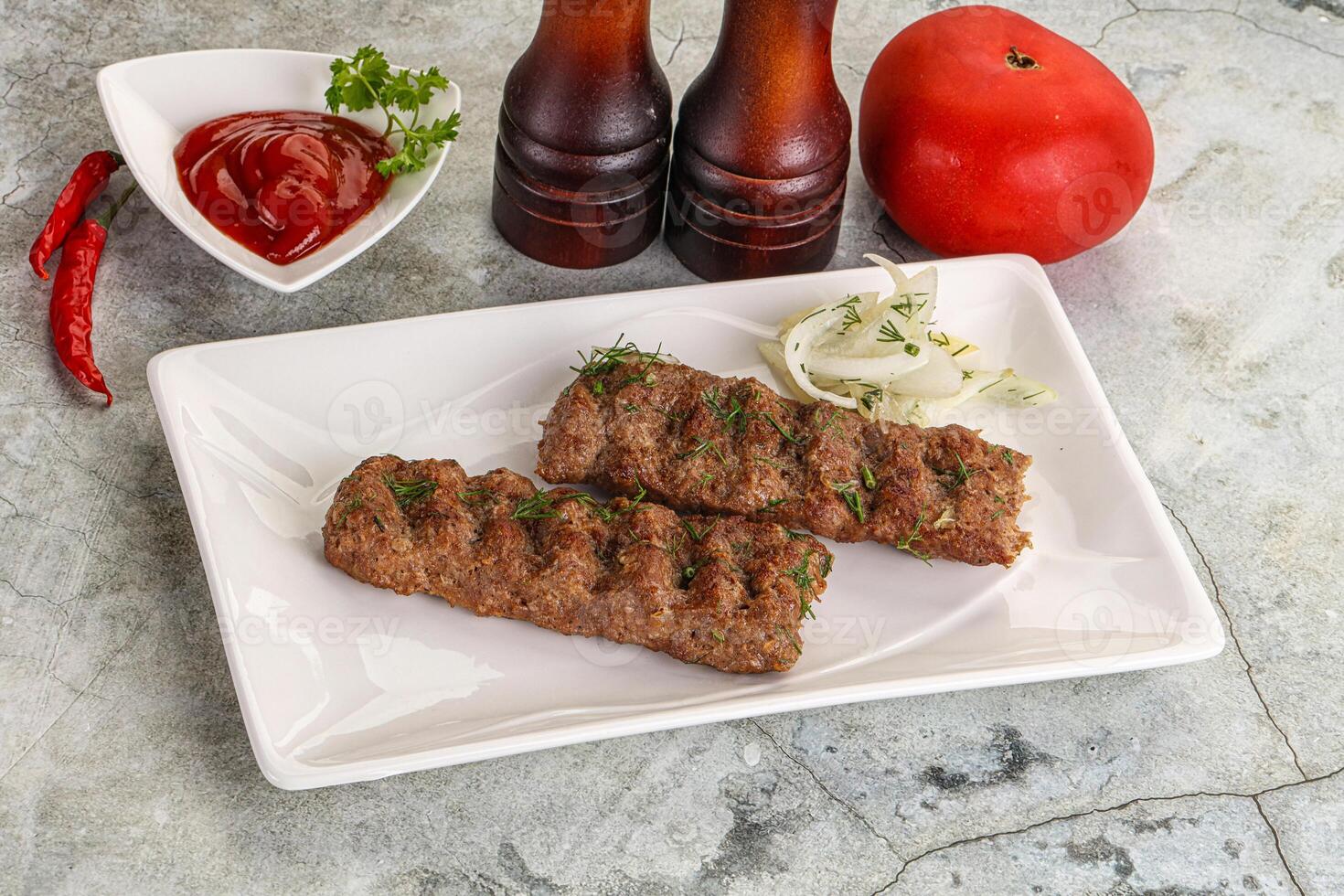 Kebab with beef served onion photo