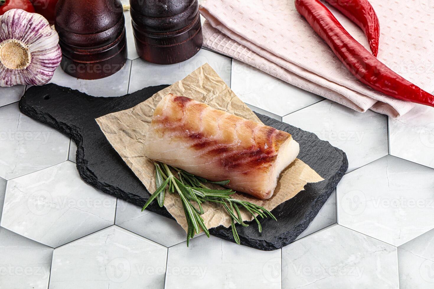 Raw cod fish steak for cooking photo