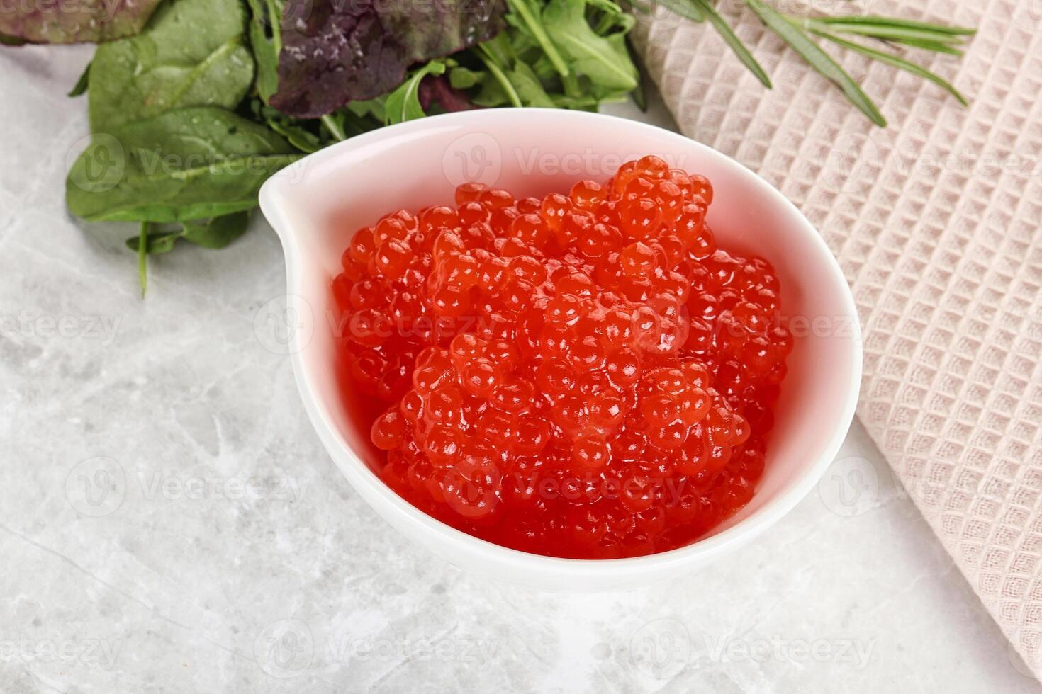 Red caviar in the bowl photo