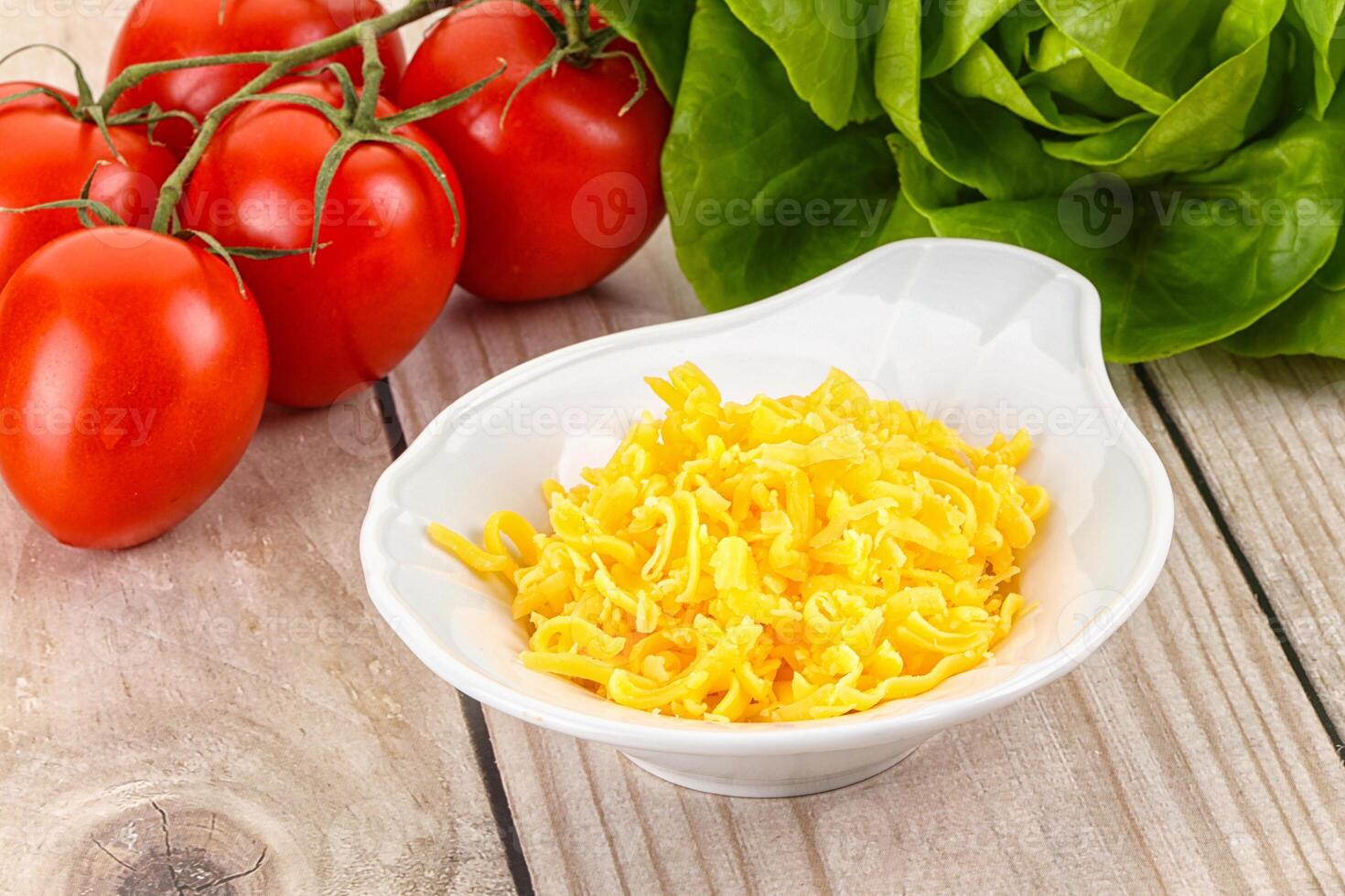 Shredded cheese in the bowl photo