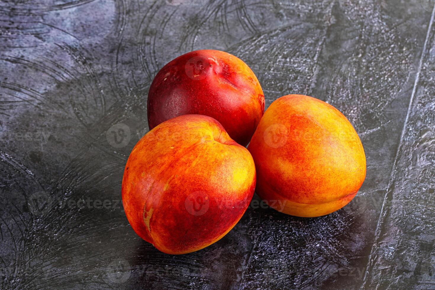 Ripe sweet juicy fresh red nectarines photo