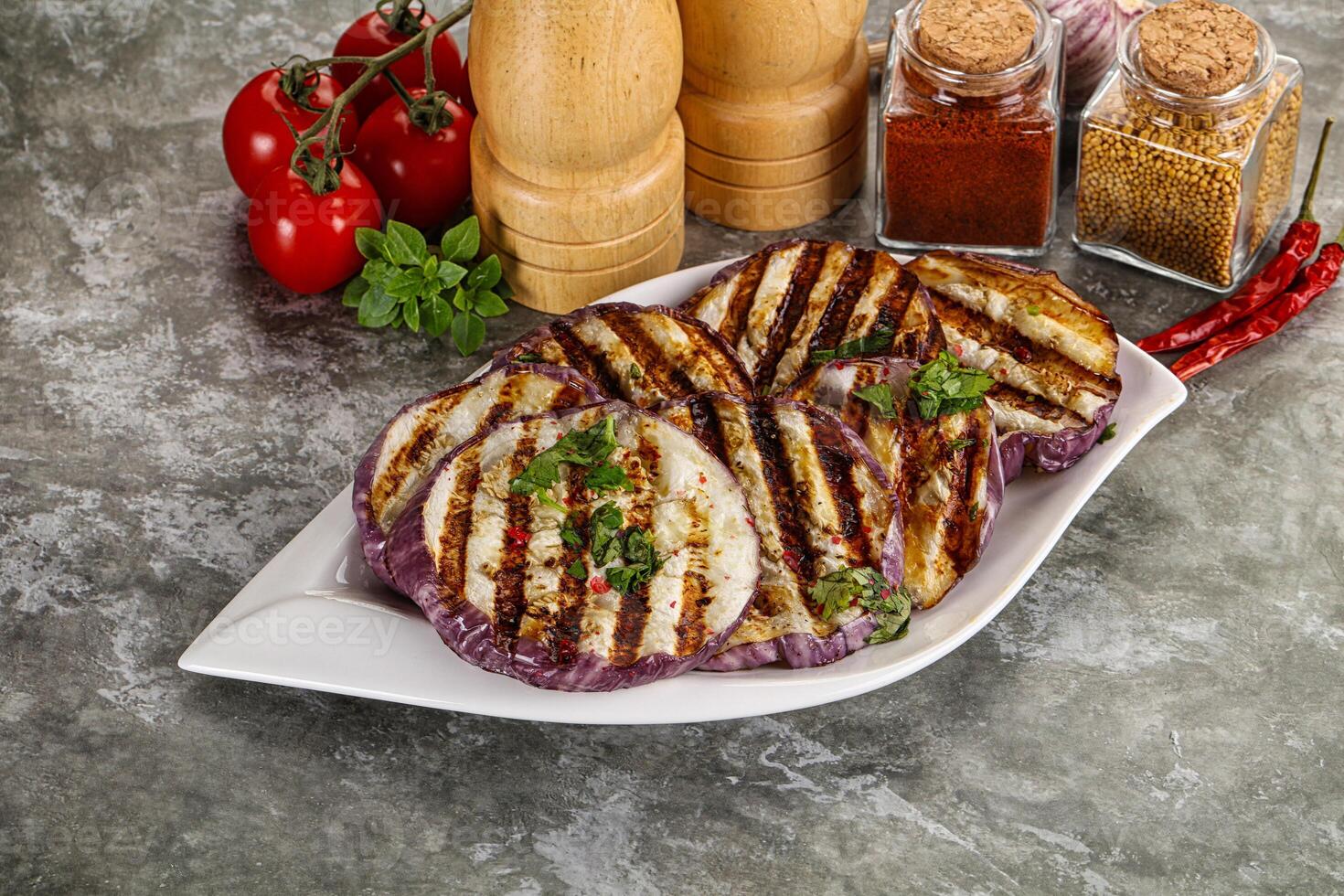 Grilled eggplant slices with cilantro photo