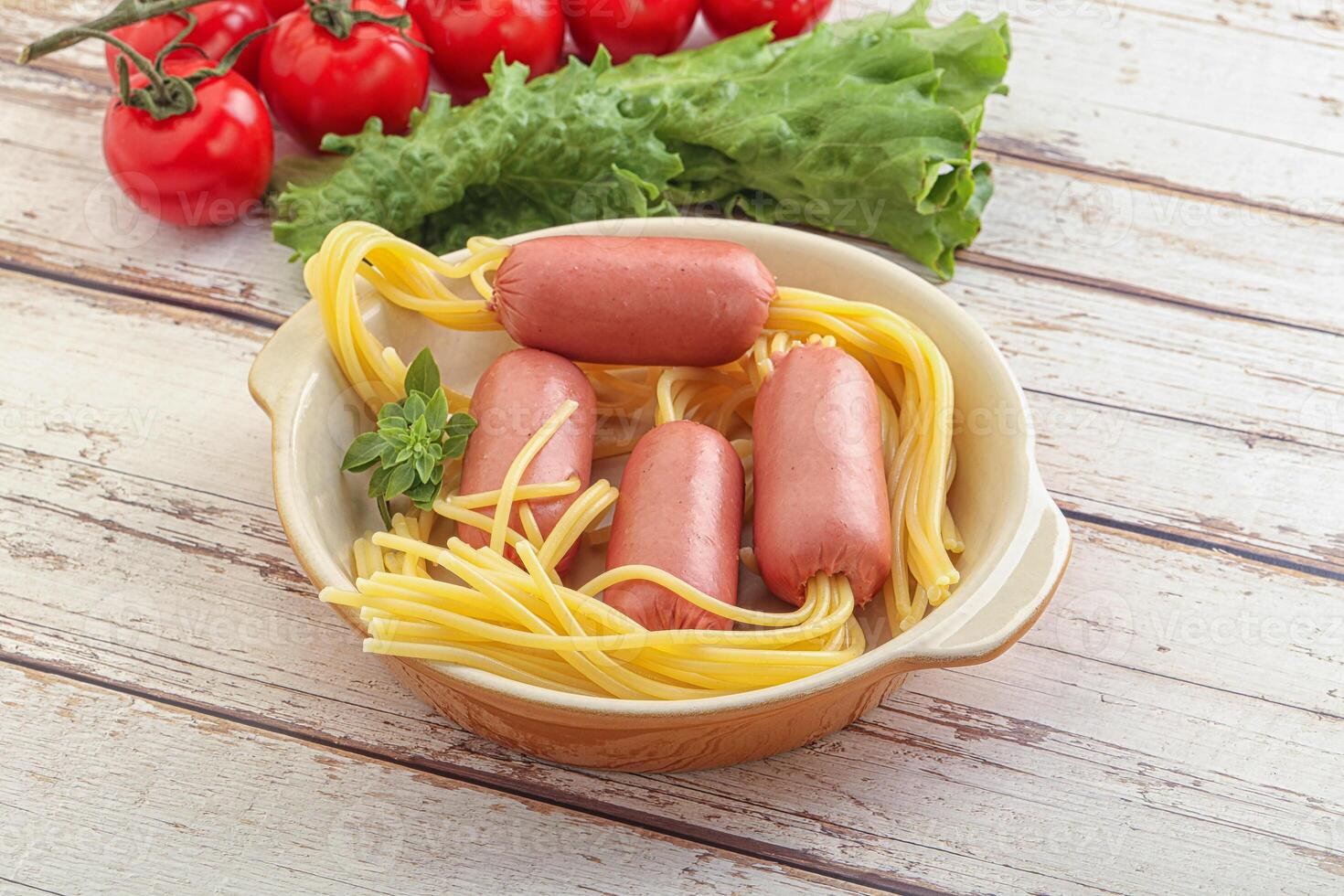 Mini sausages with pasta spaghetti photo