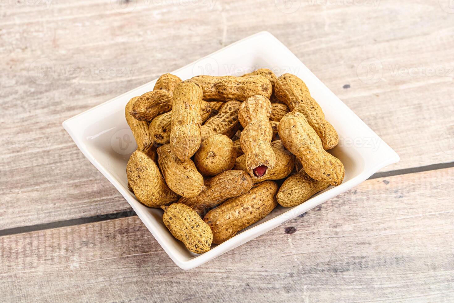 Raw ripe unpeeled peanut heap photo