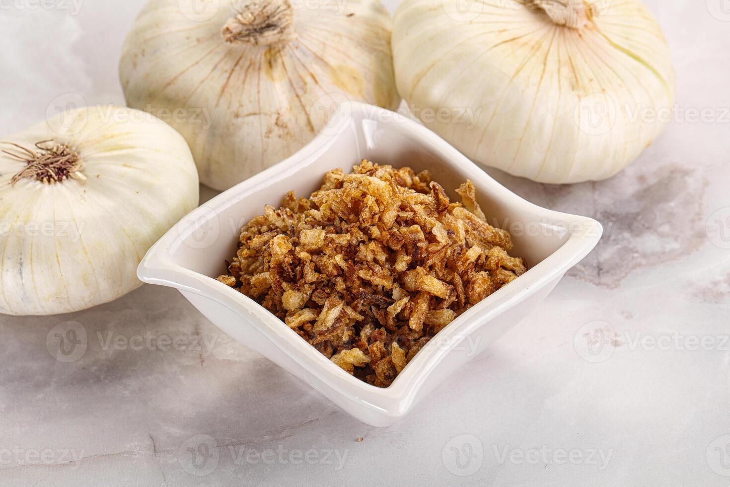 Dried roasted onion flakes for culinary photo