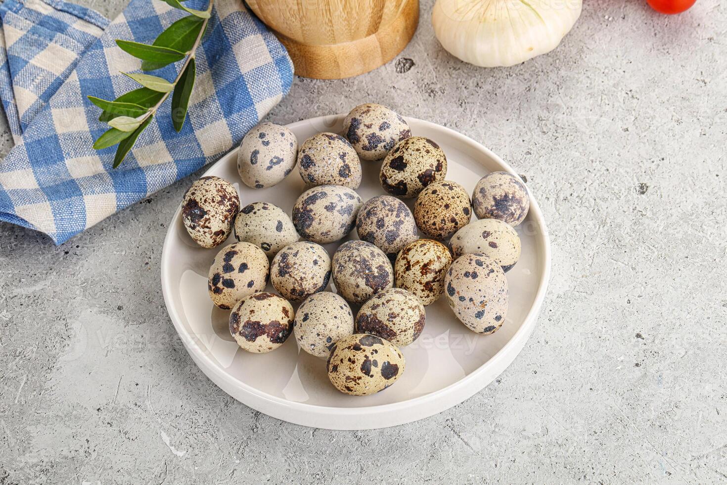 Raw quail eggs in the bowl photo