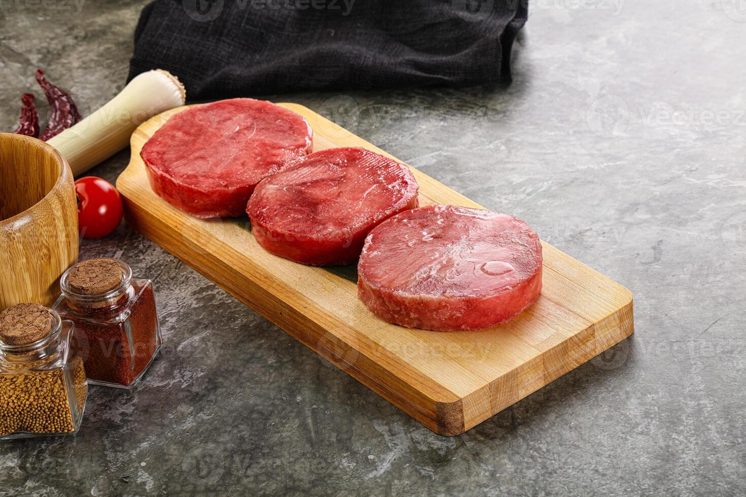 Delicous raw tuna medallion for cooking photo