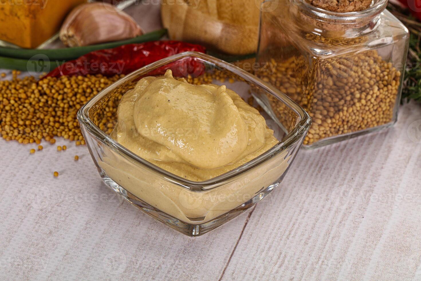 Dijon mustard sauce in the bowl photo