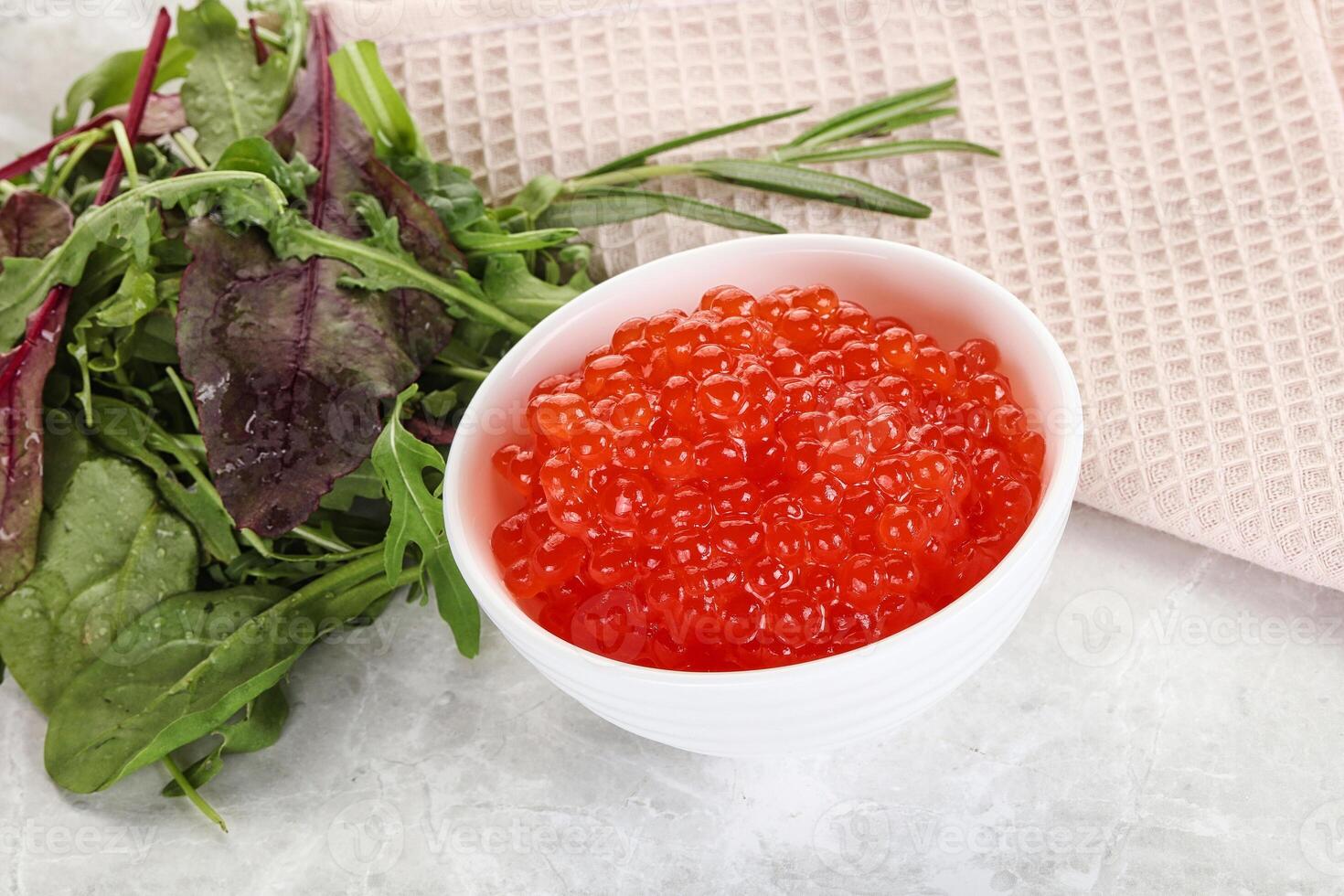 Red caviar in the bowl photo