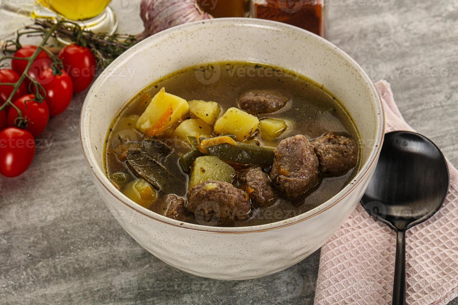 Soup with meatball and potato photo