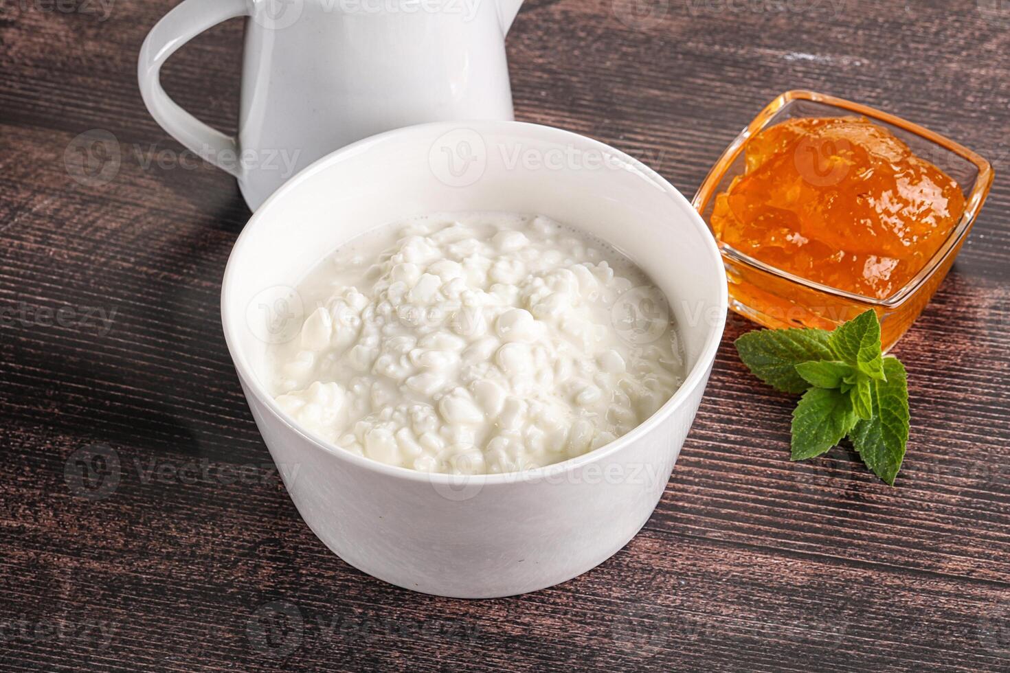 Grain curd with cream and jam photo