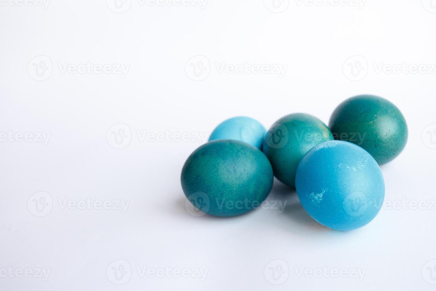 Row of ombre blue Easter eggs isolated on white background photo