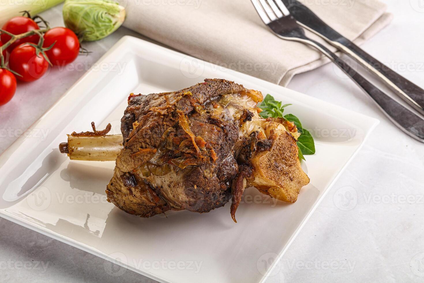 Baked Lamb shank with bone photo