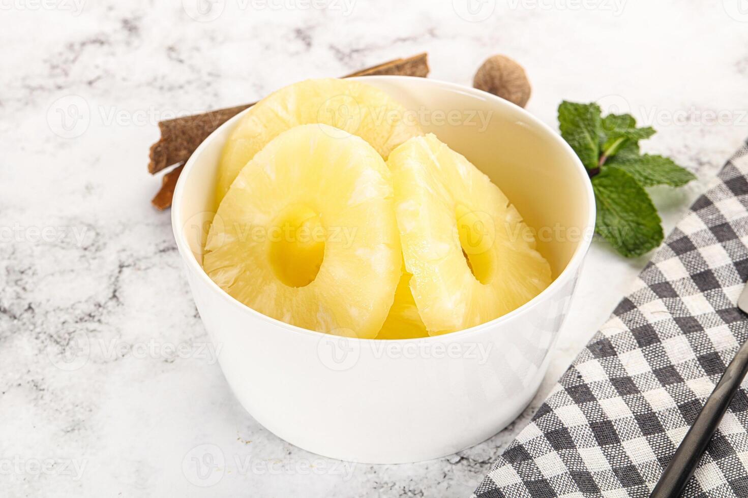 Sweet Canned pineapple in the bowl photo