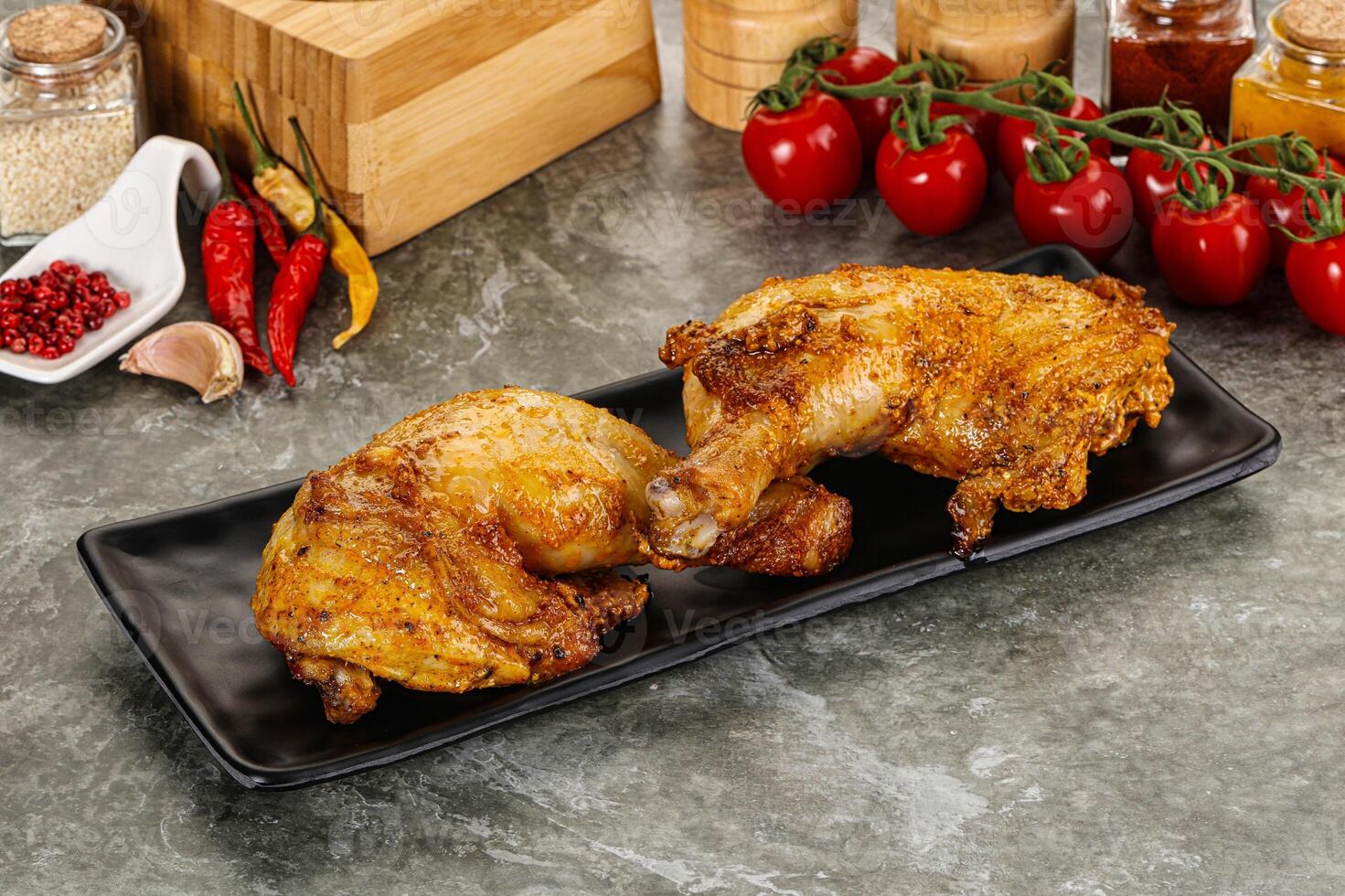 Roasted chicken leg with spices photo