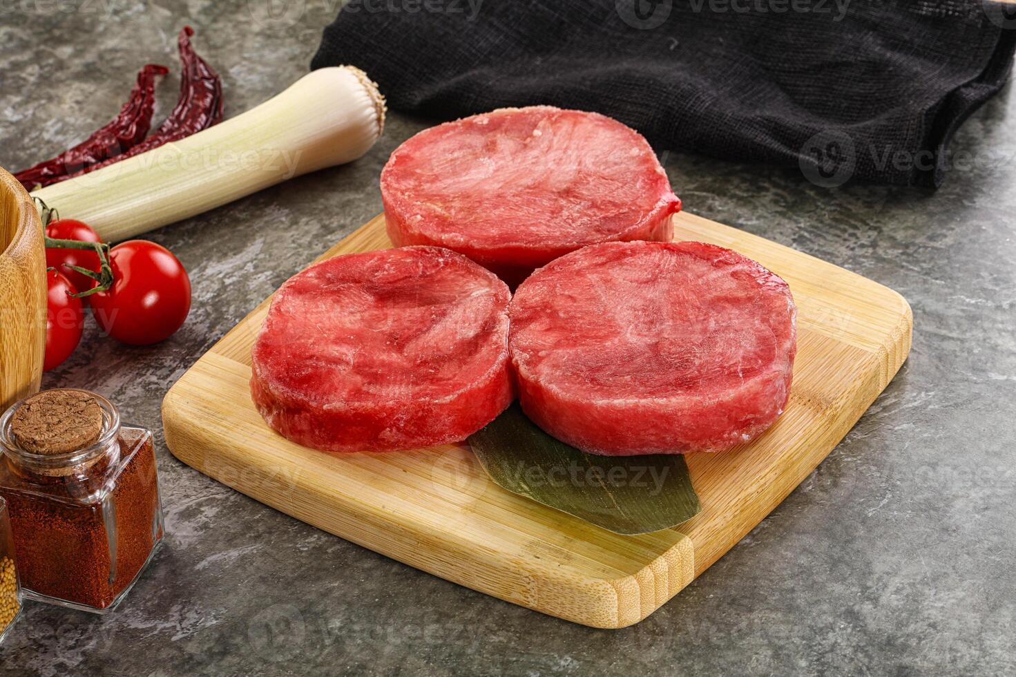 Delicous raw tuna medallion for cooking photo