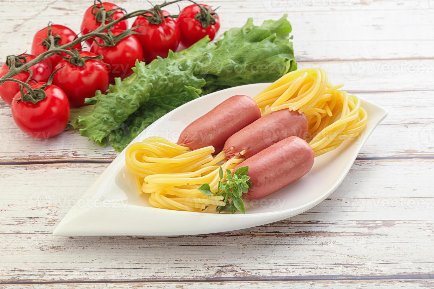 Mini sausages with pasta spaghetti photo