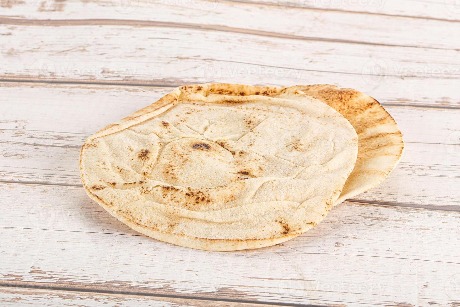 Traditional eastern round pita bread photo