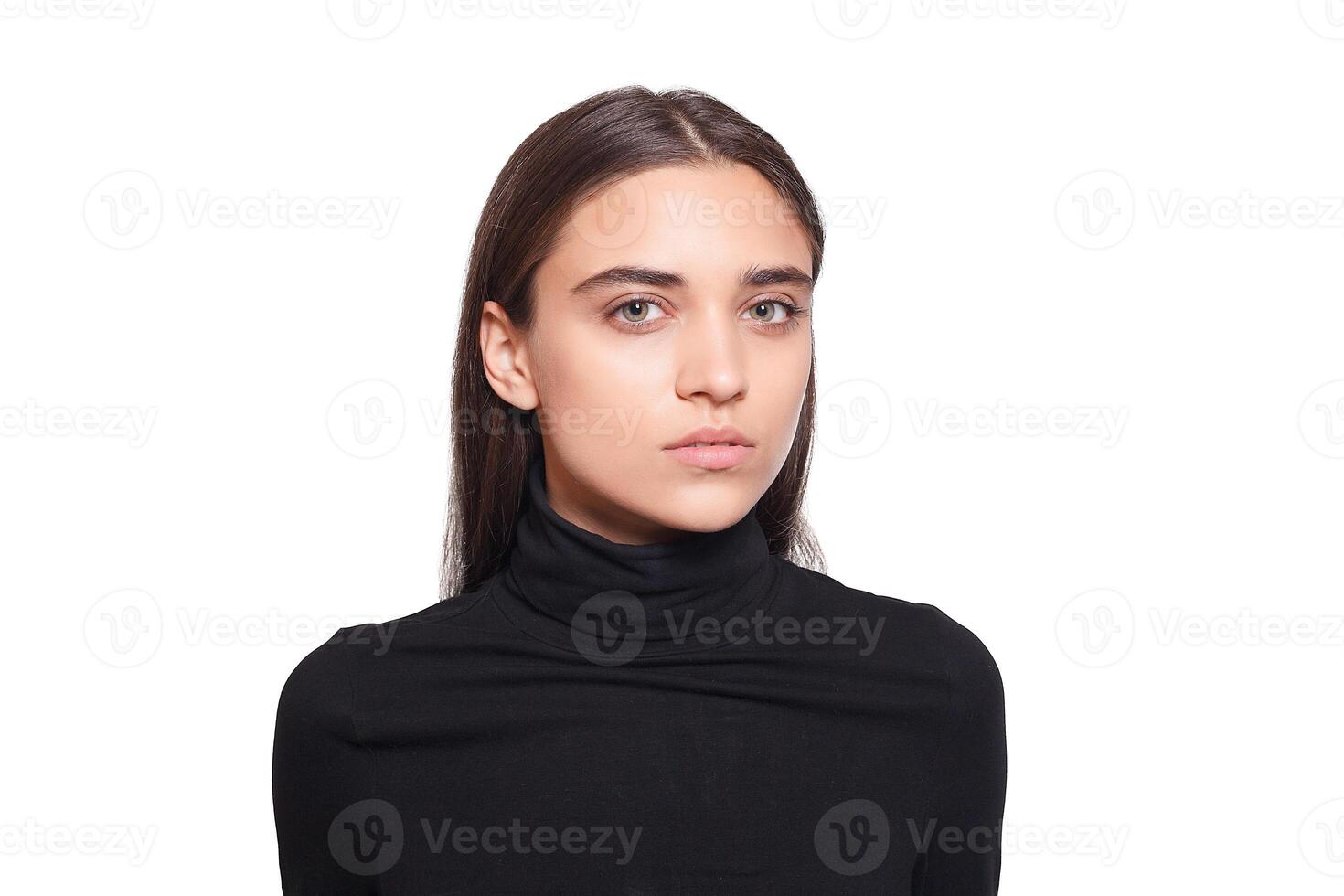 Confident female wearing black turtleneck sweater while posing photo