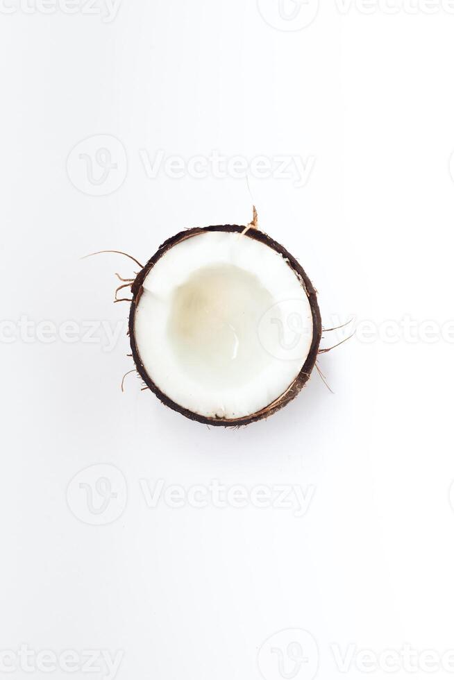 Half of coconut closeup on a white background photo