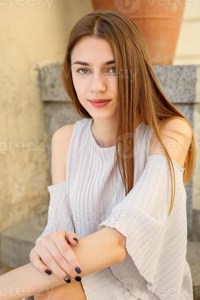 Beautiful brunette young woman wearing fashionable clothes photo