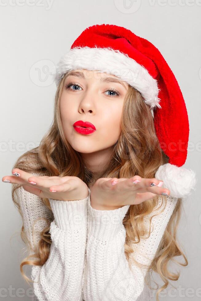 Beautiful female model wear santa hat photo