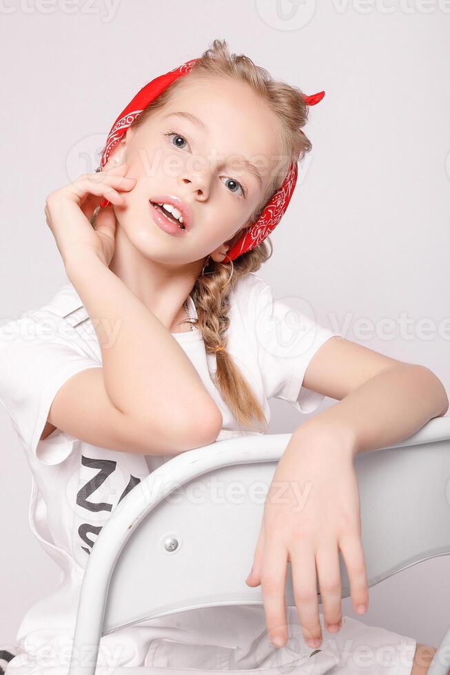 Light brown hair beautiful little girl in white t-shirt photo