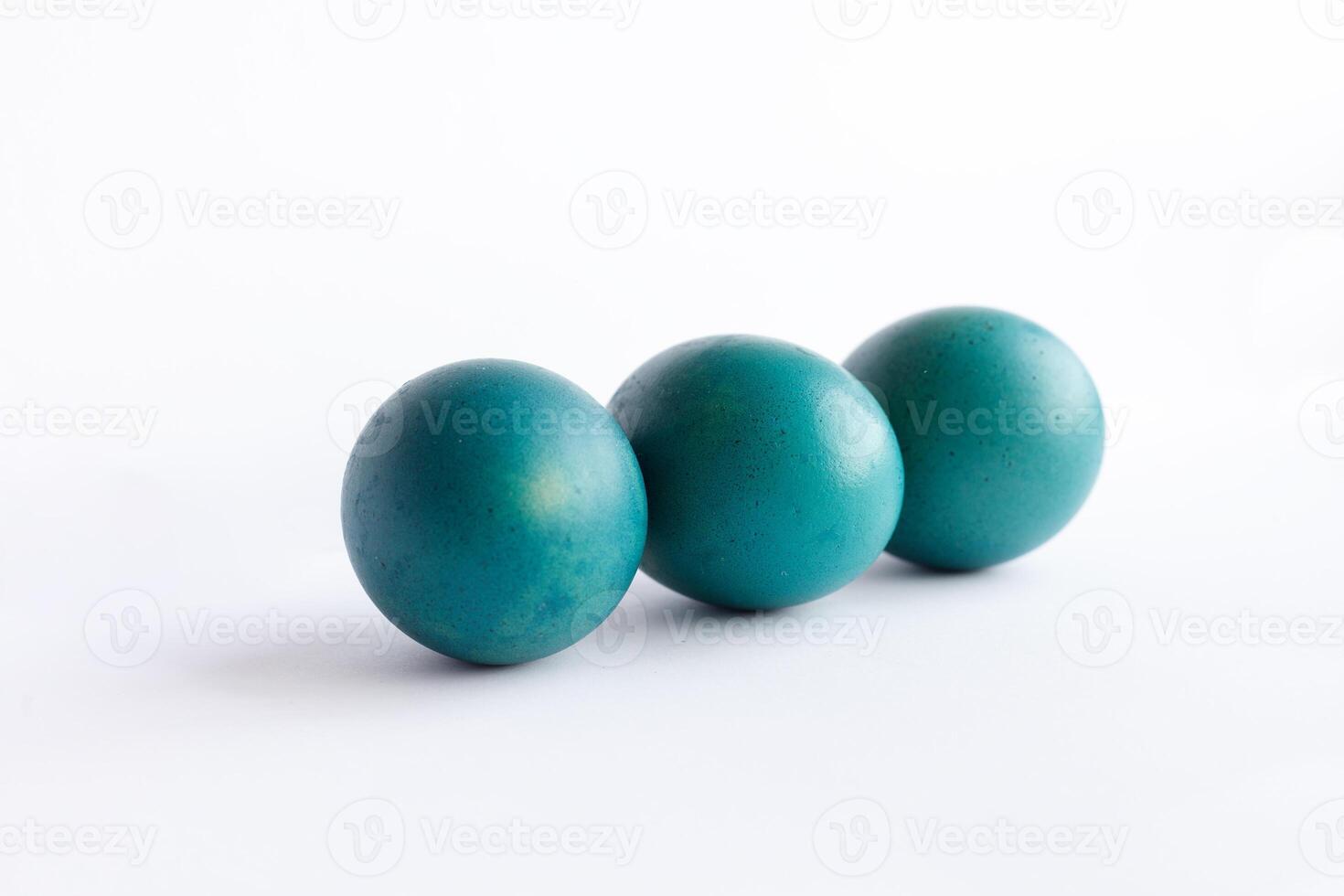 Row of ombre blue Easter eggs isolated on white background photo