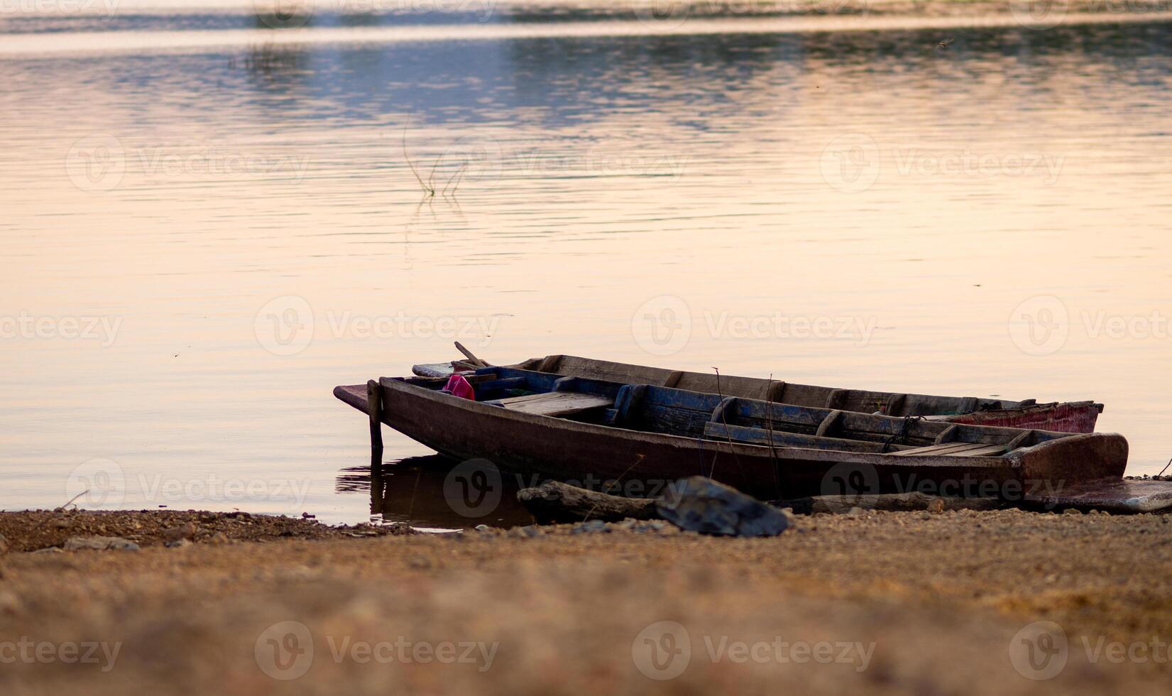 Old Fishing Boat Drifting on River photo