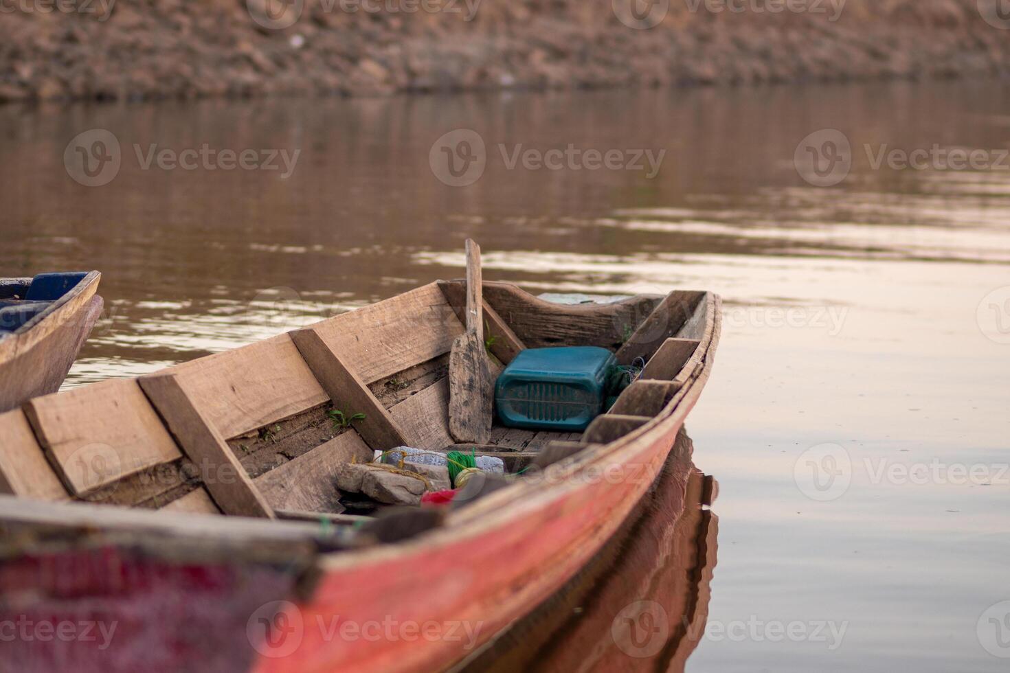 Old Fishing Boat Drifting on River photo