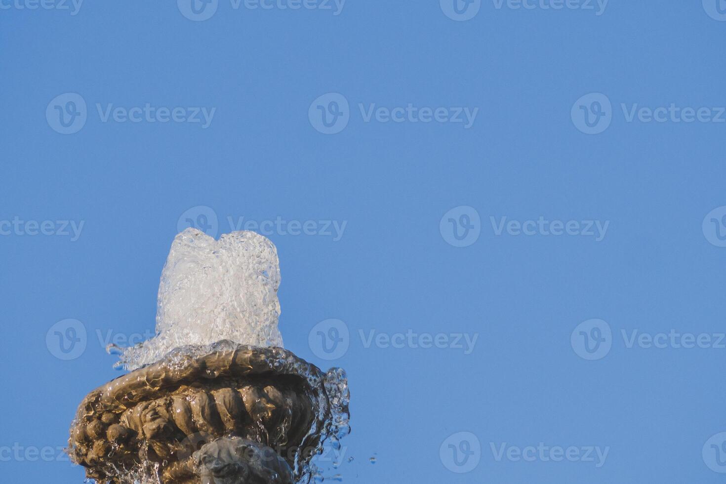 Ancient Roman Column with Stone Statue Amidst Ruins at Thailand photo