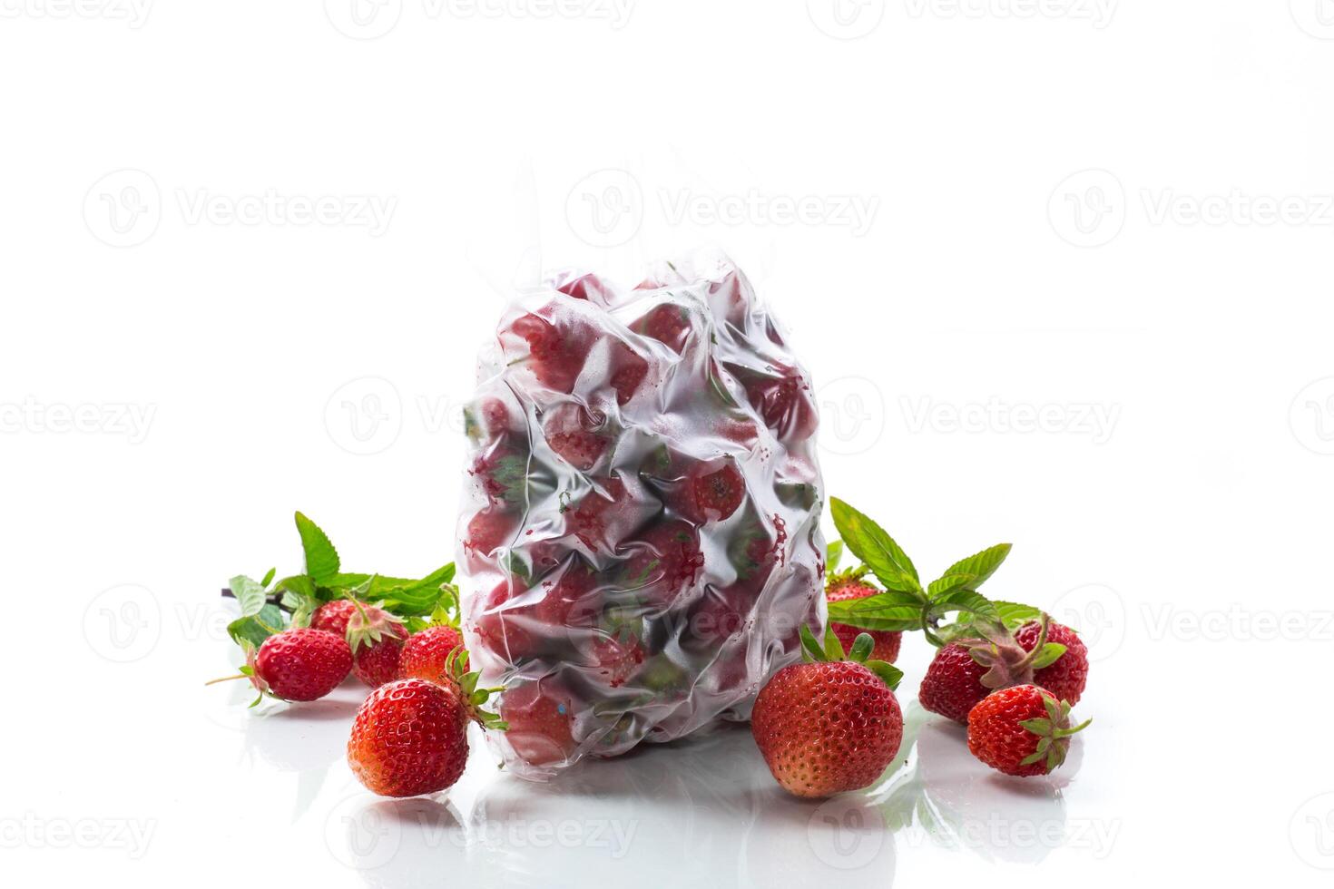 frozen fresh strawberries in a vacuum bag photo