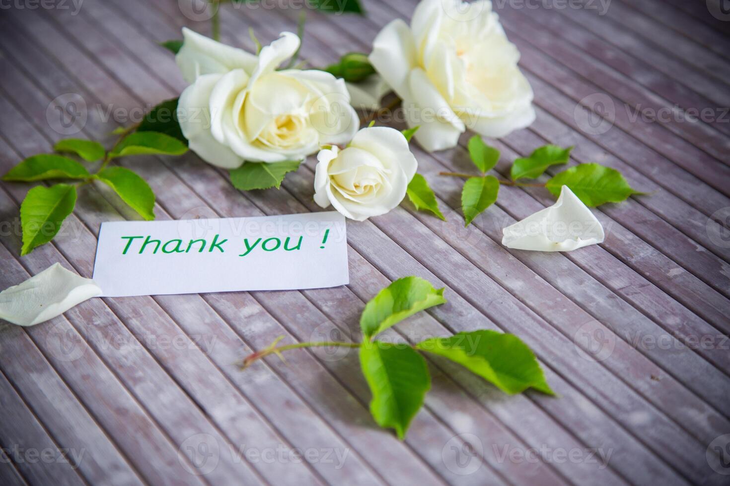 beautiful white summer roses, on a wooden table photo