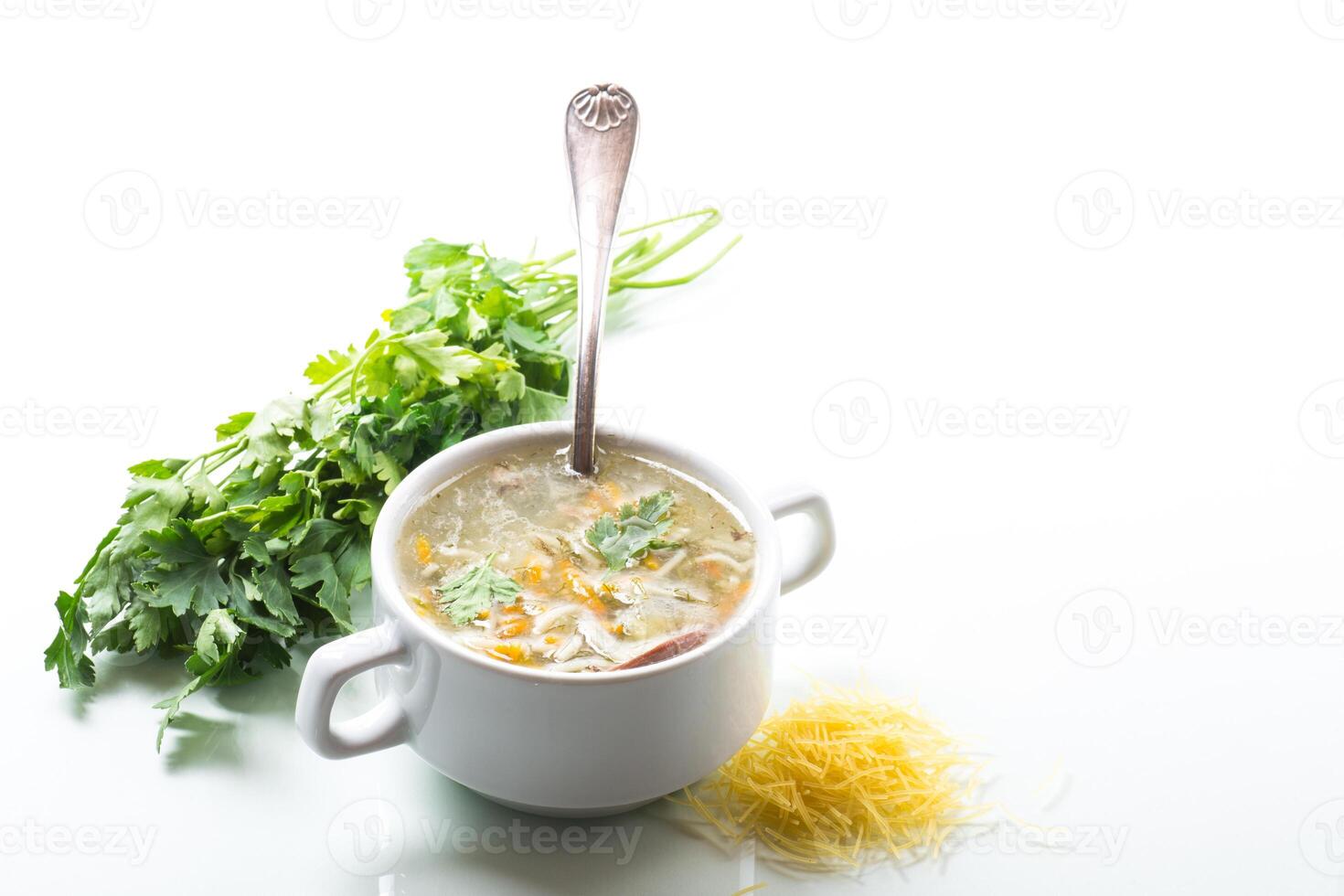 cooked hot soup with noodles and vegetables photo