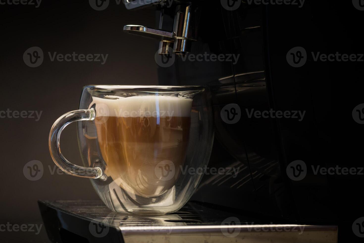 hot coffee with milk on black background photo
