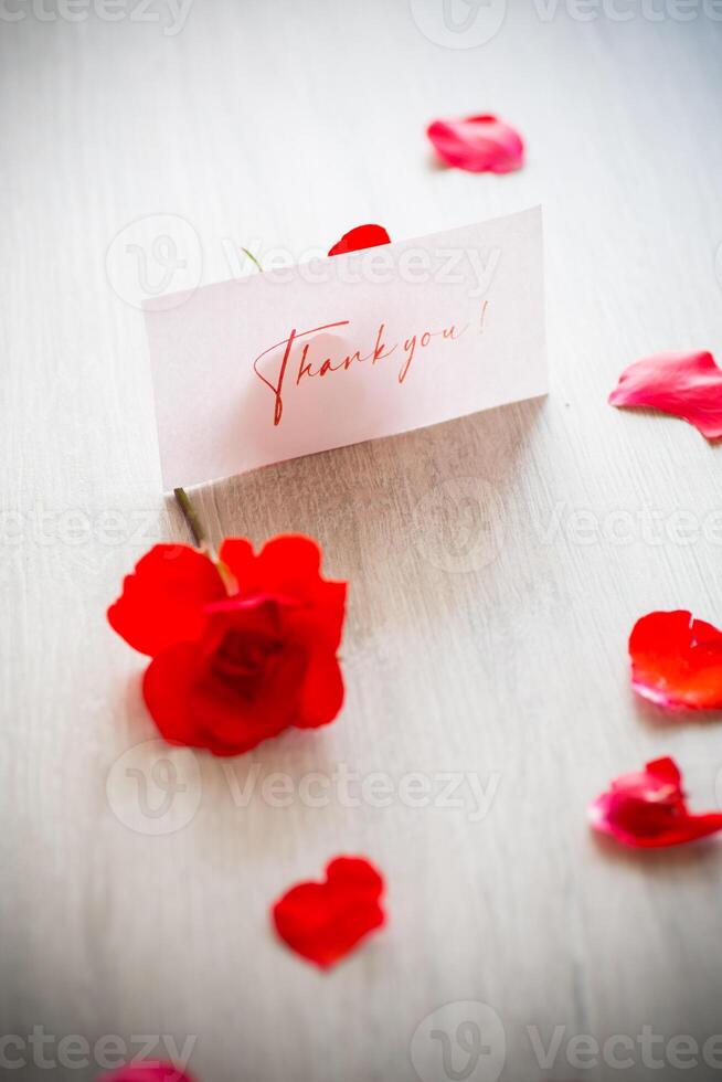 bouquet of beautiful red roses in a basket on table photo