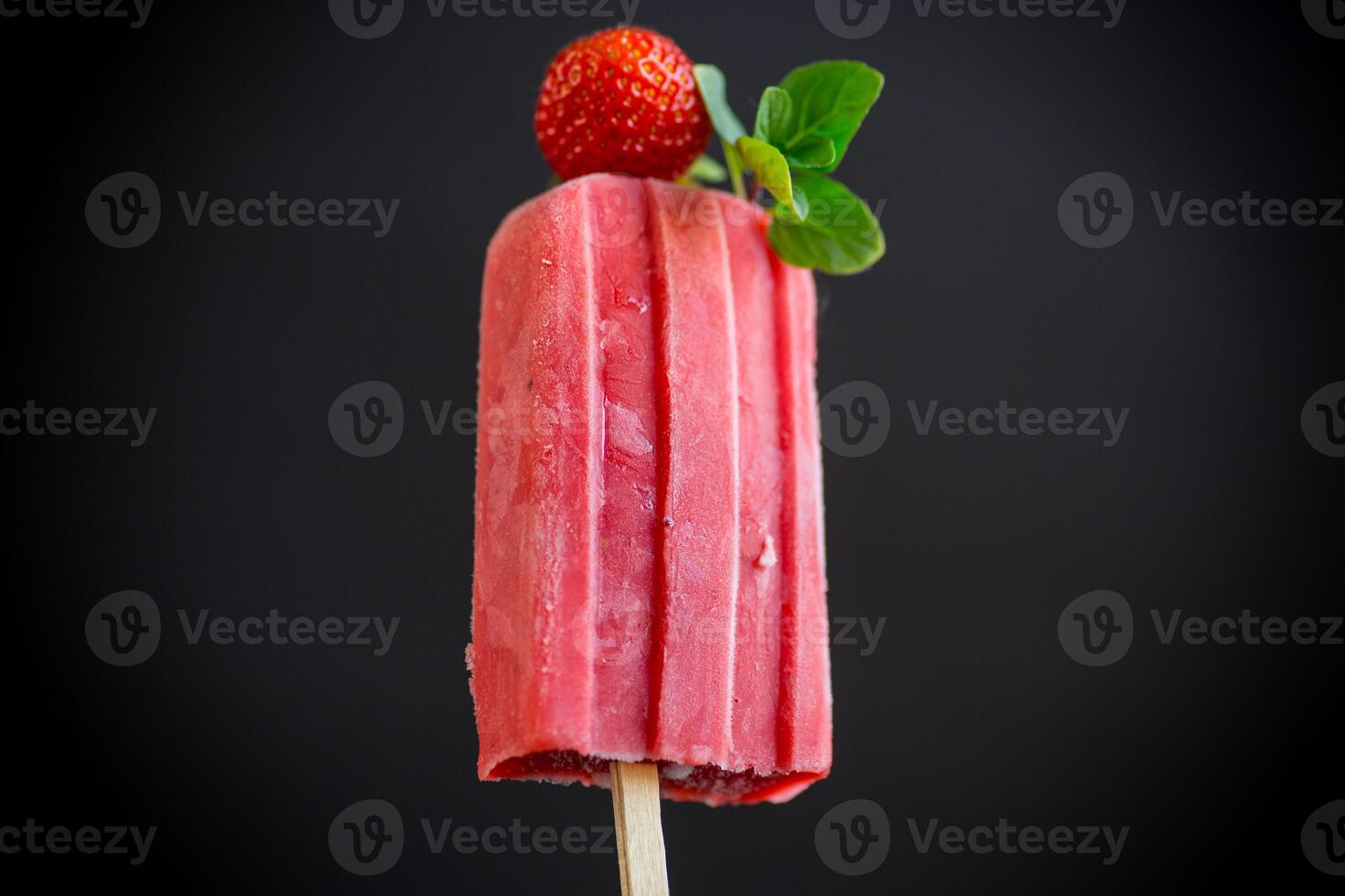 cooked homemade strawberry ice cream on a stick photo