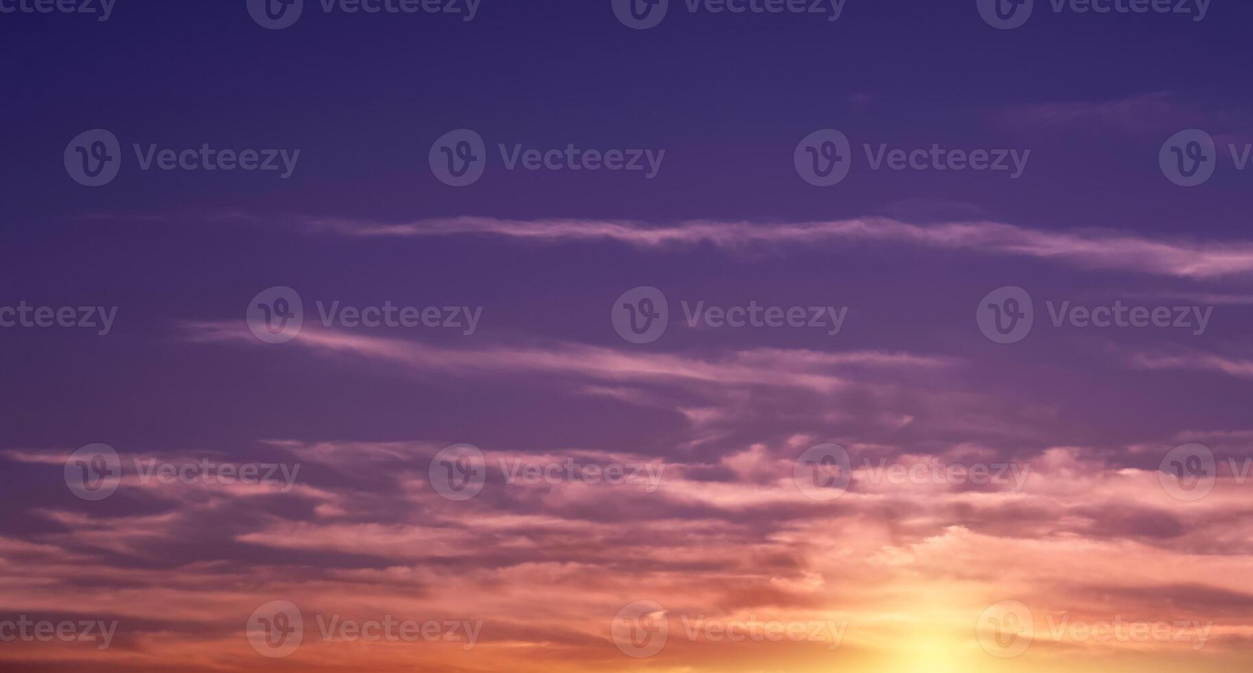 Sunset Sky,Clouds over Beach in the evening with Blue,Red, Orange,Yellow and Purple Sunlight in Summer,Beautiful panoramic nature sunrise, Romantic sky with Dusk Twilight photo