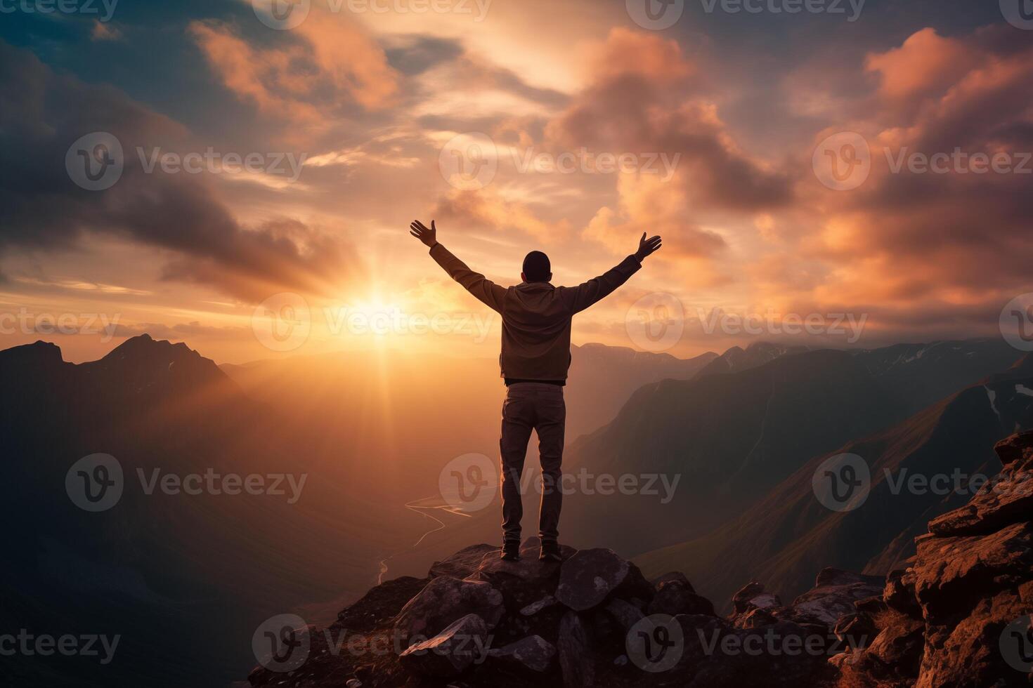 AI generated Silhouette of a man standing on top of a mountain with his hands up at sunset photo