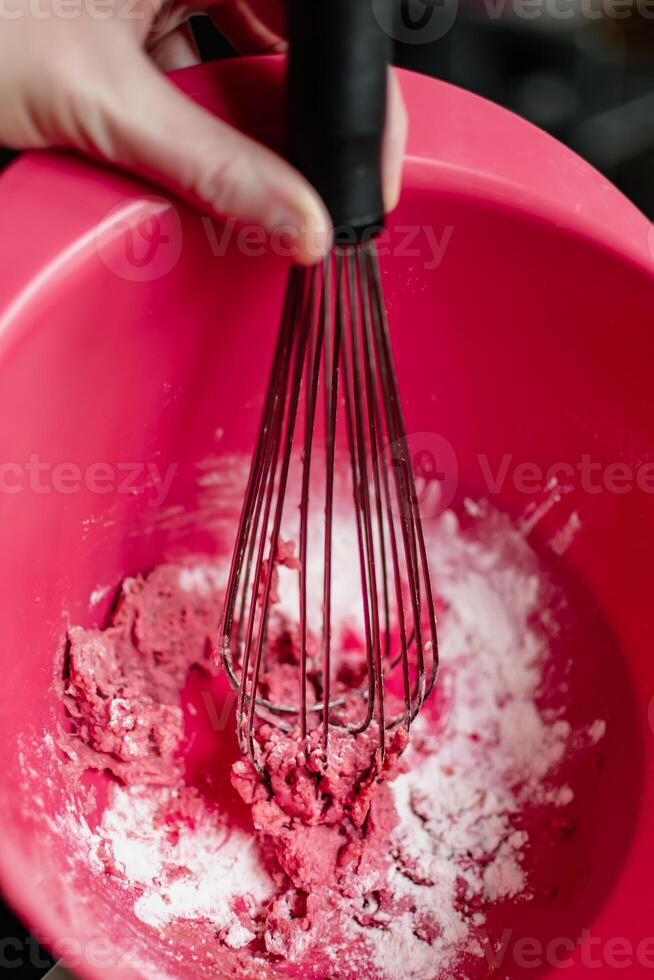 niño teniendo divertido modelado sal masa, auténtico actividad con natural rosado colorante remolacha jugo, multa motor habilidades desarrollo foto