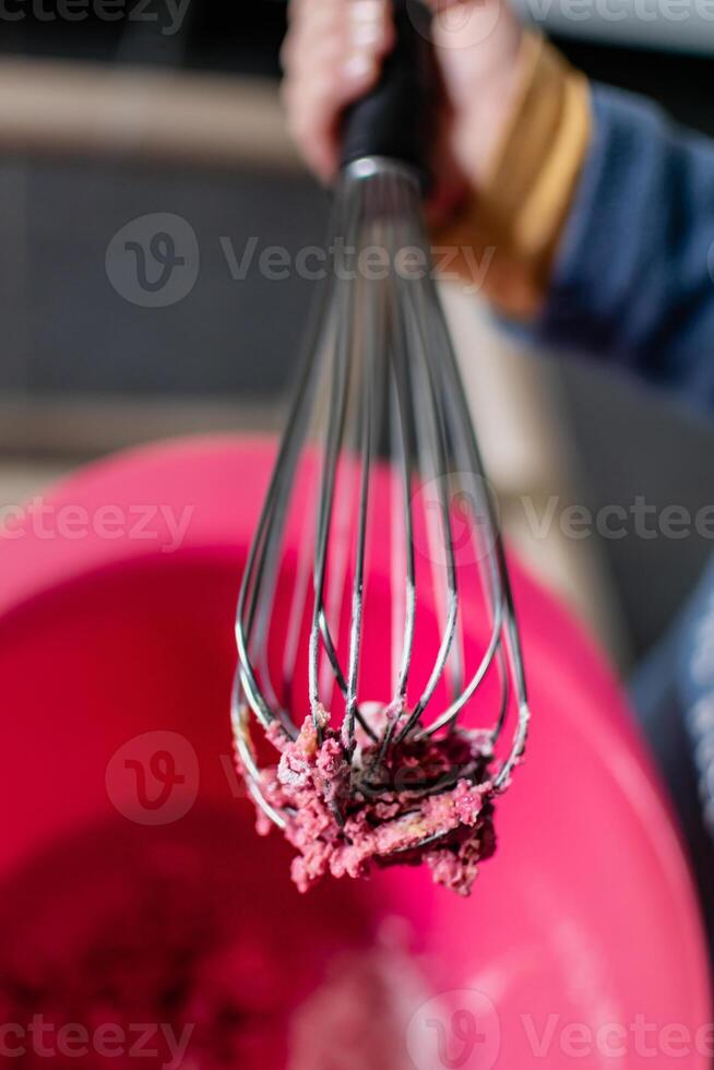Child having fun modeling salt dough, authentic activity with natural pink coloring beet juice, fine motor skills development photo